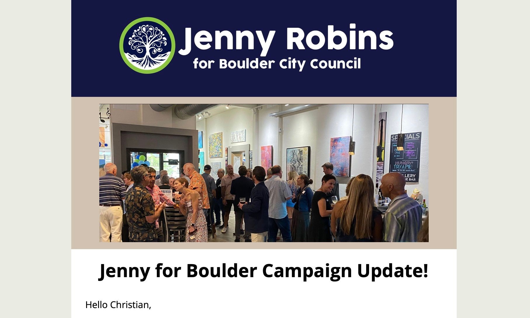 A campaign event for Jenny Robins with people socializing in an art gallery setting.